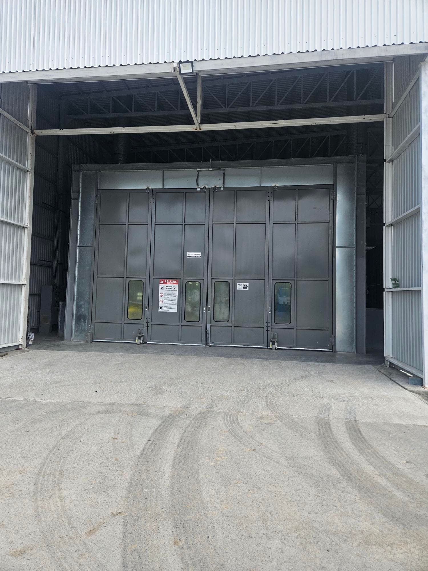 Component moving through sand blasting and the paint booth