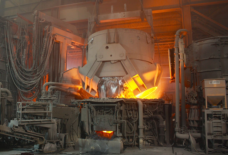 An EAFab Electric Arc Furnace being charged with recycled scrap steel during the melting process. Full redesign, engineer, and manufacture.