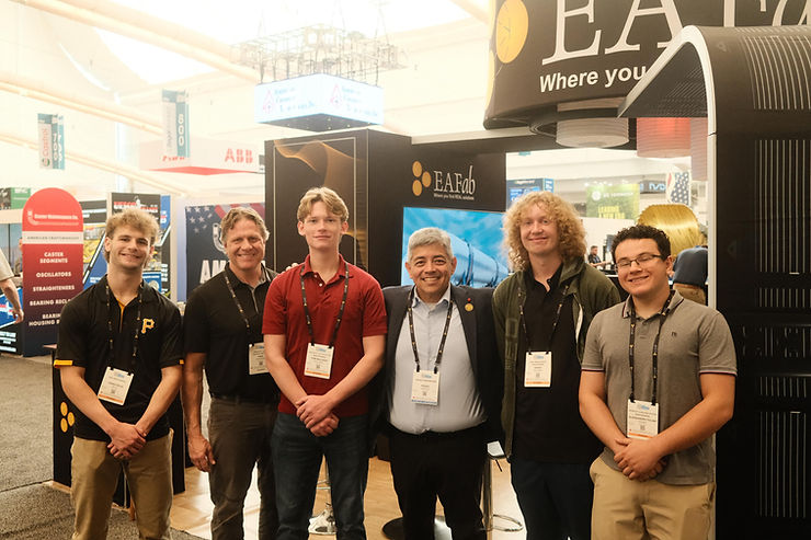 USC High School STEAM Students with EAFab Corporation at the steel industry's premier trade show. Engineering. Technology. Real Solutions.