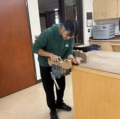 Student working on cart for project. EAFab Corporation, serving the North American steel industry with engineering services, fabricated equipment, and real solutions.